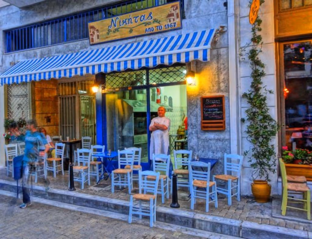 Nikitas taverna in Psyrri — traditional blue and white chairs on the pavement since 1967